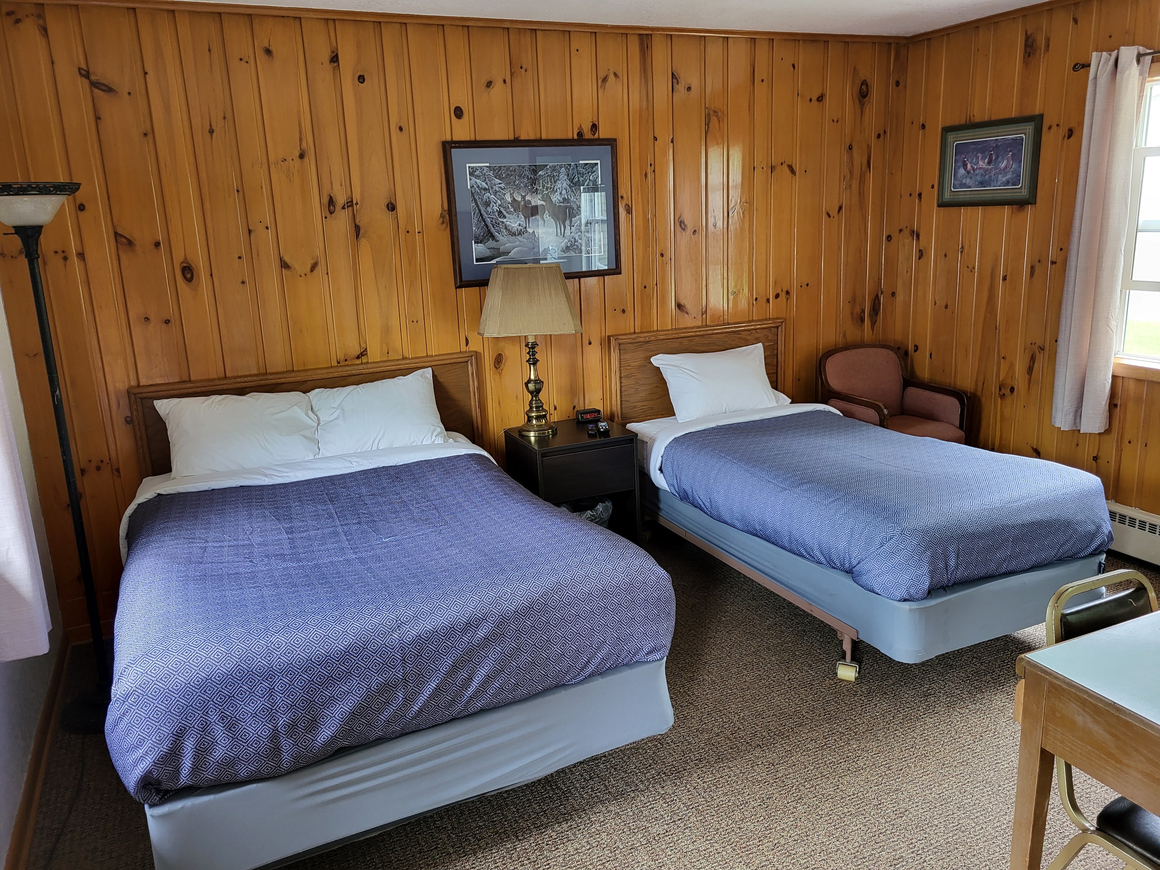 Pine Wood Motel Room 3 — king bed with warm lighting