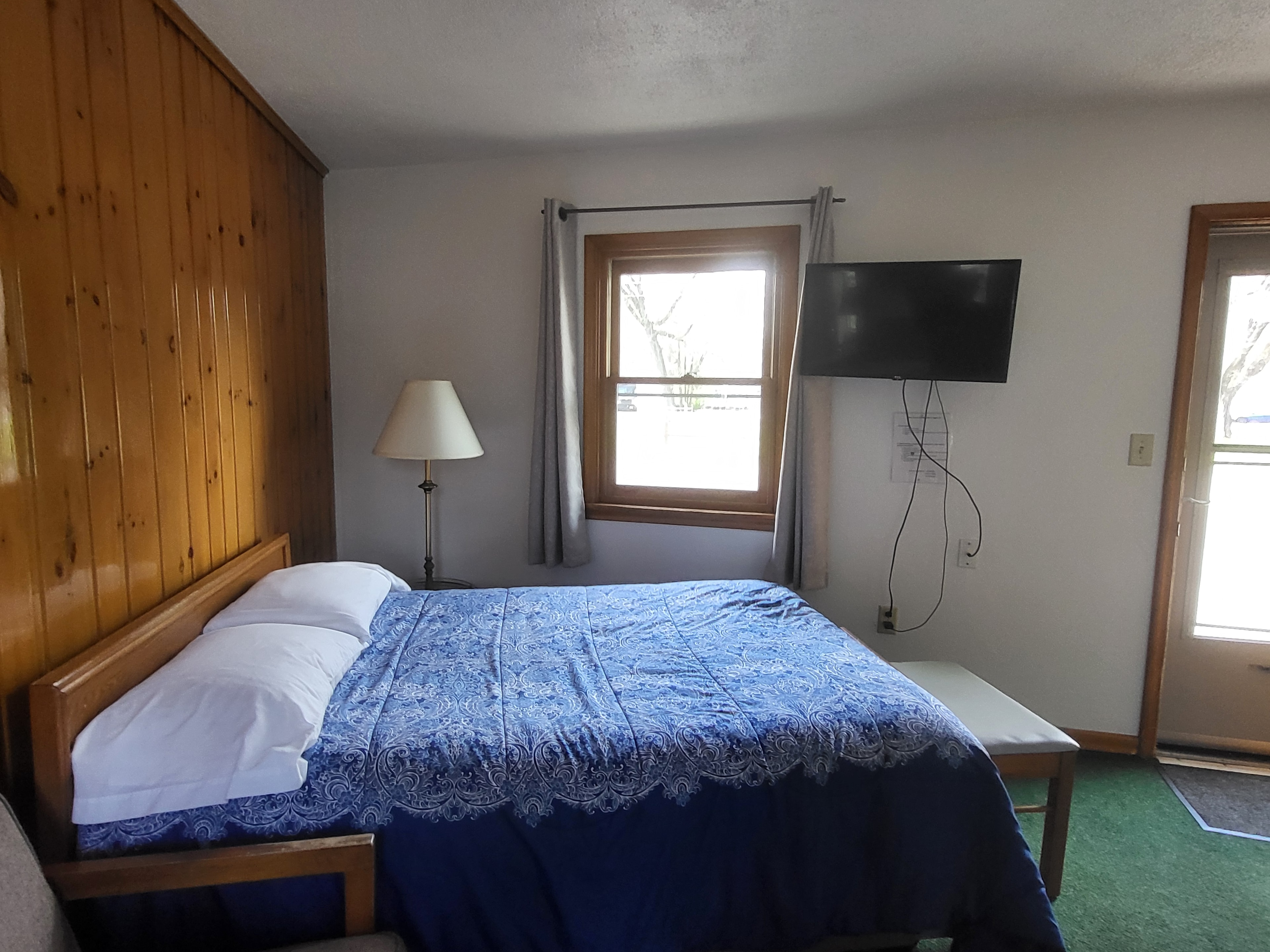 Pine Wood Motel Room 4 — queen bed with nature decor